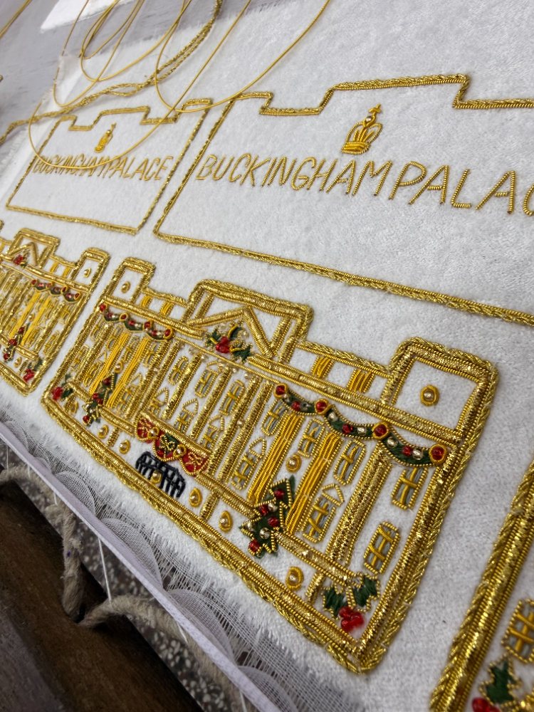Filling the design with gold and coloured thread